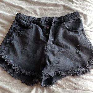 black ripped jean shorts